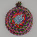 This is the bottom of the basket. It is upside down. You can really see the different colors and the knot. This is the bottom of the basket. It is upside down. You can really see the different colors and the knot.